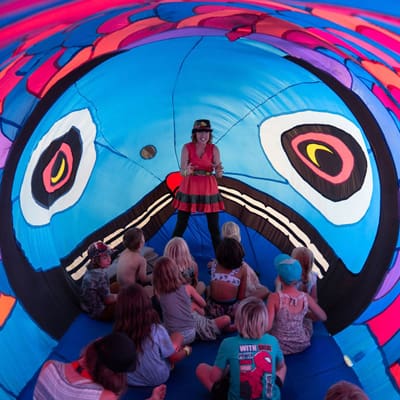 Storytime in the Haida Art inflatable Salmon with Kiki the Eco Elf